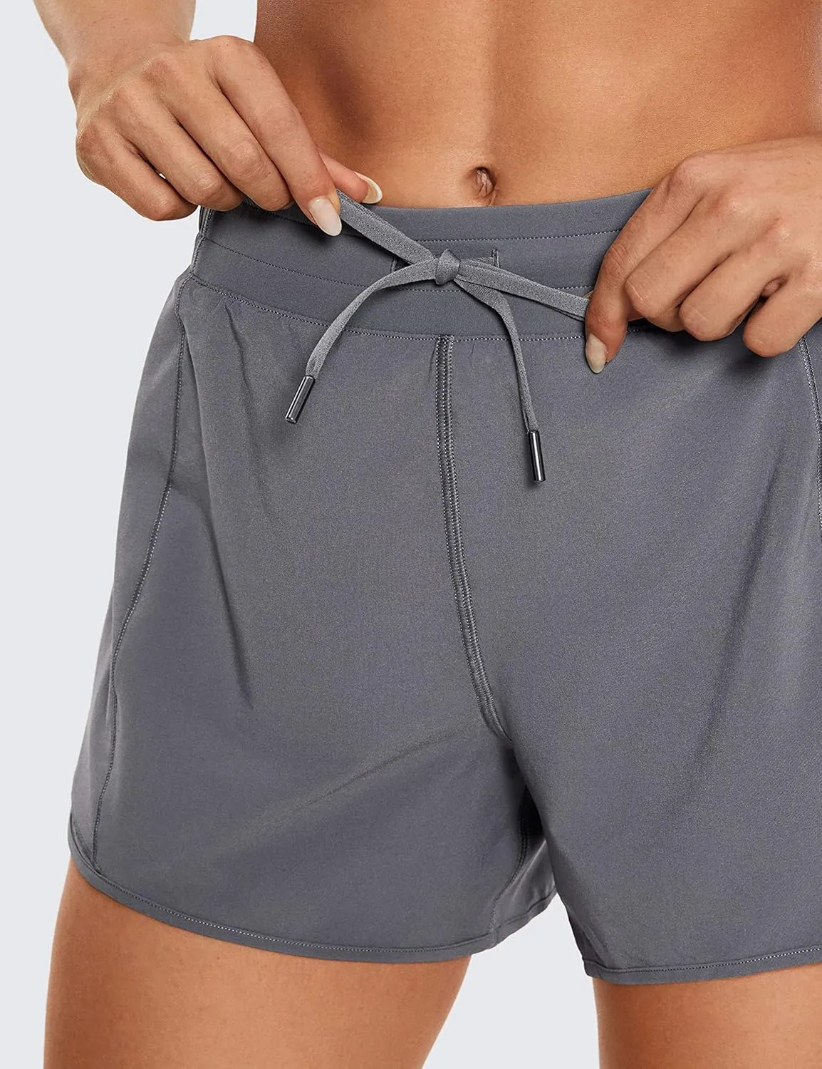 CRZ YOGA Womens Athletic Running Shorts with Zip Pocket, 4" Mid-Waist Mesh Liner Gym Workout Shorts
